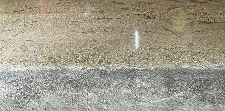 Concrete floor repair and resurfacing—side-by-side view of a worn floor section next to a newly resurfaced, smooth finish.
